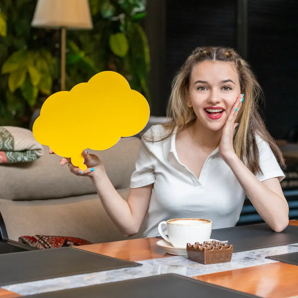 cute-lady-holding-idea-board-smiling-camera